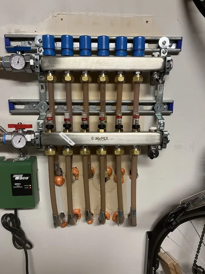 Plumber performing Water Heater Repair at a residential property in Newfane